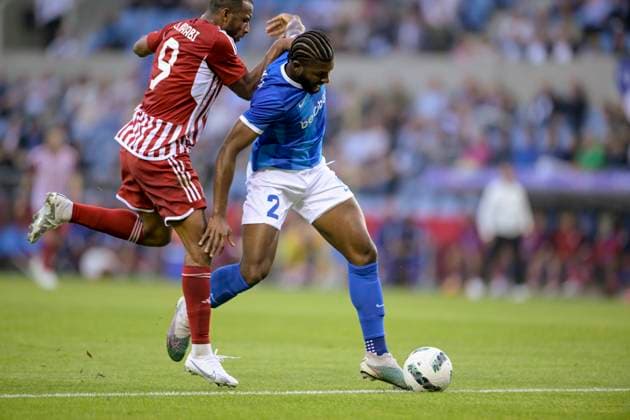 KRC Genk v Olympiacos - UEFA Europa League Qualifying GENK, BELGIUM - AUGUST 17 : McKenzie Mark defender of KRC Genk battles for the ball with Ayoub El Kaabi forward of Olympiacos FC during the second leg match of the UEFA Europa League season 2023 - 2024 third qualifying round between KRC Genk and Olympiacos on August 17, 2023 in Genk, BELGIUM, 17 08 2023 Genk BELGIUM  Copyright: xSesx