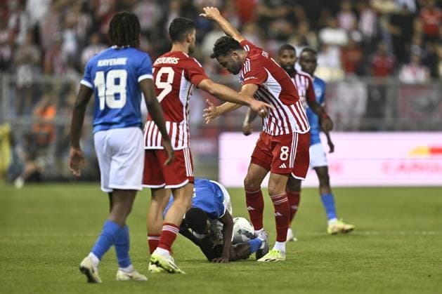 Genk s Alieu Fadera and Olympiacos Vincente Iborra fight for the ball during a soccer game between Belgian KRC Genk and Greek Olympiacos F.C., Thursday 17 August 2023 in Genk, the second leg of the third qualifying round for the UEFA Europa League competition. JOHAN EYCKENS JohanxEyckens  x72170448x