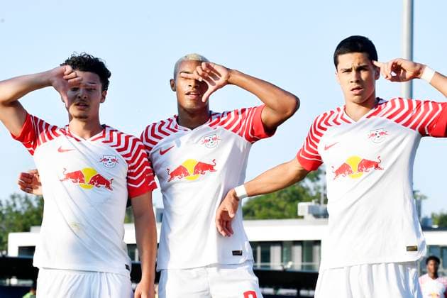 Soccer A Junioren Bundesliga Nord Nordost, season 2023 2024, 3 matchday, RasenBallsport Leipzig U19 vs VfL Wolfsburg U19 23 08 2023 Goal for RB Leipzig U19 in the match RBL U19 vs Wolfsburg U19 23 08 2023 Aris Bayindir central midfield RB Leipzig U19, back number 17 left scores 1 0 and cheers with Yannick Eduardo central midfielder RB Leipzig U19, back number 9 center and Jakob Sachse central midfielder RB Leipzig U19, back number 16 right Leipzig Saxony Germany RB Training Center at Cottaweg, grass field 1