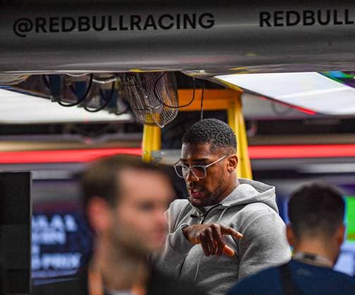 24th August 2023; Circuit Zandvoort, Zandvoort, North Holland, Netherlands; Formula 1 Heineken Dutch Grand Prix 2023; Arrivals and Inspection Day; Anthony Joshua OBE two times unified World Heavyweight boxing champion asks questions in the Oracle Red Bull Racing team garage  ActionPlus12546433 GodfreyxPitt