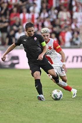 L-R Dmytro Myshnyov (Luhansk) and Christos Zafeiris (Slavia) in action during the UEFA Europa League, play-off, 1st leg, SK Slavia Praha vs FC Zorya Luhansk, on August 24, 2023, in Prague, Czech Republic. (CTKxPhoto VitxSimanek) CTKPhotoP2023082407742  CTKPhotoP2023082407742