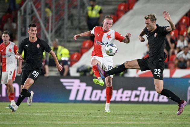 Petr Sevcik (Slavia), center, and Petar Micin (Luhansk), right, in action during the UEFA Europa League, play-off, 1st leg, SK Slavia Praha vs FC Zorya Luhansk, on August 24, 2023, in Prague, Czech Republic. (CTKxPhoto VitxSimanek) CTKPhotoP2023082408723 CTKPhotoP2023082408723