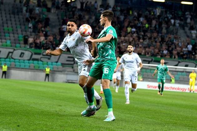 Leandro Andrade of Qarabag in action against Ahmet Muhamedbegovic of Olimpija Ljubljana during the UEFA Europa League, Play Off round, 1st leg match between Olimpija Ljubljana (Slovenia) and Qarabag (Azerbaijan) FOOTBALL : Olimpija Ljubljana v Qarabag - Europa league - 24 08 2023 IgorKupljenik Panoramic 