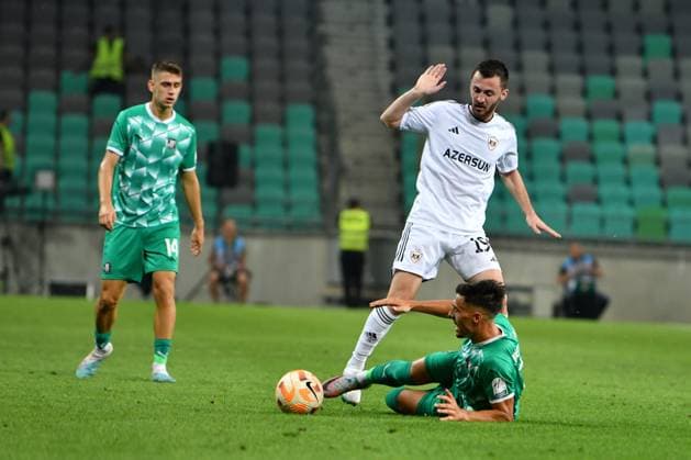 Redon Xhixha of Qarabagin action against David Sualehe of Olimpija Ljubljana during the UEFA Europa League, Play Off round, 1st leg match between Olimpija Ljubljana (Slovenia) and Qarabag (Azerbaijan) FOOTBALL : Olimpija Ljubljana v Qarabag - Europa league - 24 08 2023 NatasaKupljenik Panoramic 