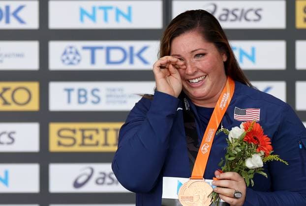 (230826) -- BUDAPEST, Aug. 26, 2023 -- Bronze medalist DeAnna Price of the United States celebrates during the awarding ceremony for the women s hammer throw final during the World Athletics Championships in Budapest, Hungary, Aug. 25, 2023. ) (SP)HUNGARY-BUDAPEST-ATHLETICS-WORLD CHAMPIONSHIPS-DAY 7 LixYing 