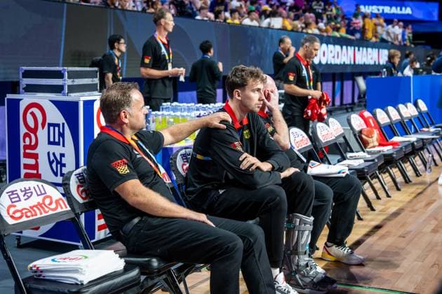 Basketball Okinawa 27 08 2023 FIBA Basketball World Cup 2023 World Cup mens preliminary round Australia AUS Germany GER Franz Wagner Germany, No 09 injured with special shoe can not participate in the game Oliver Pütz team doctor li