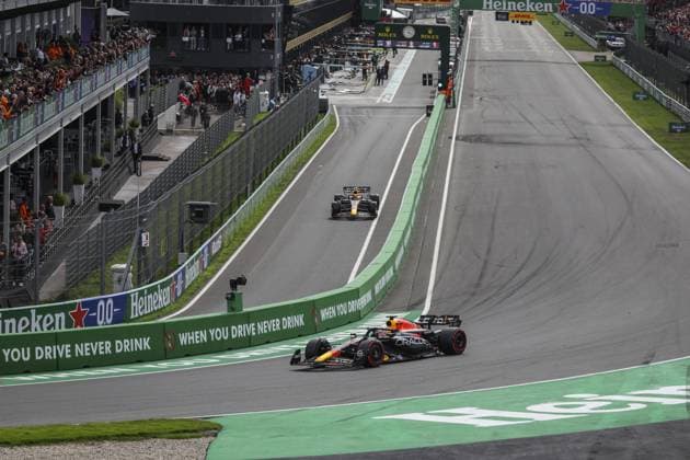01 VERSTAPPEN Max (nld), Red Bull Racing RB19, action with 11 PEREZ Sergio (mex), Red Bull Racing RB19 during the 2023 Formula 1 Heineken Dutch Grand Prix, 13th round of the 2023 Formula One World Championship, WM, Weltmeisterschaft from August 25 to 28, 2023 on the Zandvoort Circuit, in Zandvoort, Netherlands - F1 - DUTCH GRAND PRIX 2023 - RACE DPPI Panoramic  GOOD3154