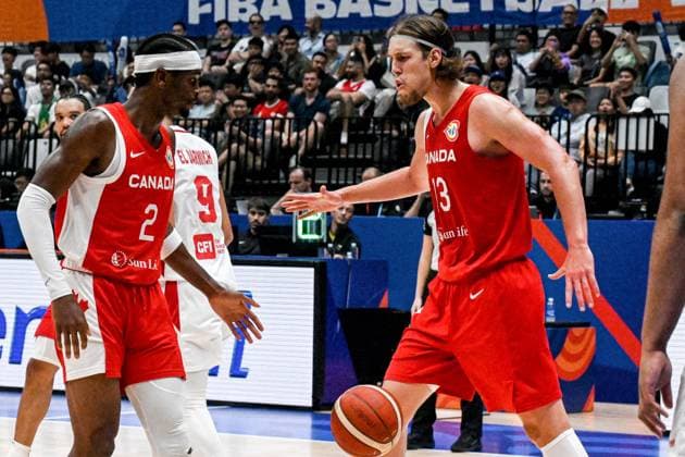 (230827) -- JAKARTA, Aug. 27, 2023 -- Shai Gilgeous-Alexander (L) of Canada celebrates scoring with his teammate Kelly Olynyk during the Group H match between Lebanon and Canada at the 2023 FIBA World Cup in Jakarta, Indonesia, Aug. 27, 2023. ) (SP)INDONESIA-JAKARTA-BASKETBALL-FIBA WORLD CUP-GROUP H-LBN VS CAN AgungxKuncahyaxB. 