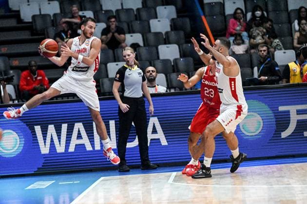(230827) -- JAKARTA, Aug. 27, 2023 -- Wael Arakji (L) of Lebanon passes the ball during the Group H match between Lebanon and Canada at the 2023 FIBA World Cup in Jakarta, Indonesia, Aug. 27, 2023. ) (SP)INDONESIA-JAKARTA-BASKETBALL-FIBA WORLD CUP-GROUP H-LBN VS CAN AgungxKuncahyaxB. 