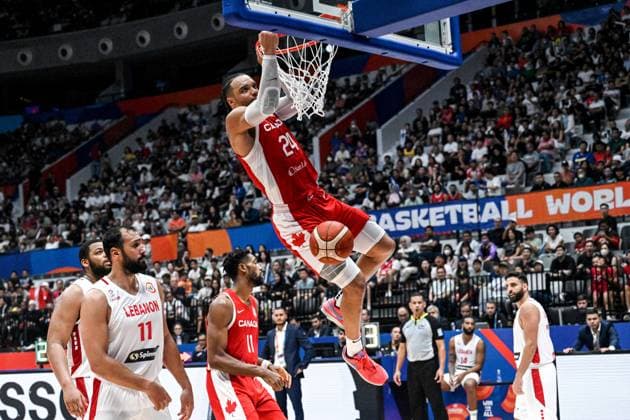 (230827) -- JAKARTA, Aug. 27, 2023 -- Dillon Brooks (Top) of Canada dunks during the Group H match between Lebanon and Canada at the 2023 FIBA World Cup in Jakarta, Indonesia, Aug. 27, 2023. ) (SP)INDONESIA-JAKARTA-BASKETBALL-FIBA WORLD CUP-GROUP H-LBN VS CAN AgungxKuncahyaxB. 
