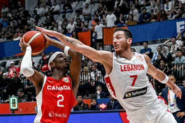 (230827) -- JAKARTA, Aug. 27, 2023 -- Shai Gilgeous-Alexander (L) of Canada vies with Karim Zeinoun of Lebanon during the Group H match between Lebanon and Canada at the 2023 FIBA World Cup in Jakarta, Indonesia, Aug. 27, 2023. ) (SP)INDONESIA-JAKARTA-BASKETBALL-FIBA WORLD CUP-GROUP H-LBN VS CAN AgungxKuncahyaxB. 