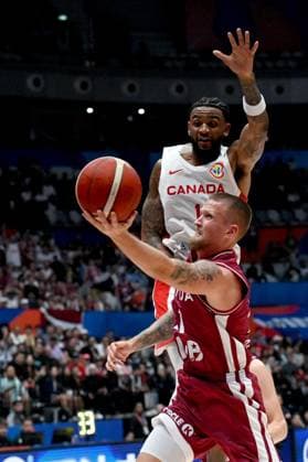 (230830) -- JAKARTA, Aug. 30, 2023 -- Aigars Skele of Latvia goes for a lay-up during the FIBA World Cup 2023 Group H match between Canada and Latvia in Jakarta, Indonesia, on Aug. 29, 2023. ) (SP)INDONESIA-JAKARTA-FIBA BASKETBALL-WORLD CUP 2023-GROUP H-CAN VS LAT AgungxKuncahyaxB. 