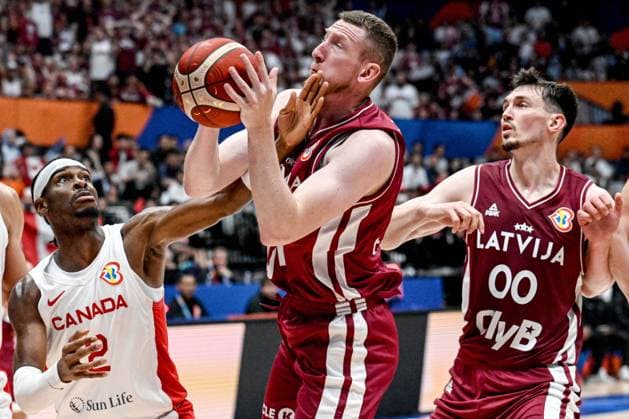 (230830) -- JAKARTA, Aug. 30, 2023 -- Rolands Smits of Latvia breaks through during the FIBA World Cup 2023 Group H match between Canada and Latvia in Jakarta, Indonesia, on Aug. 29, 2023. ) (SP)INDONESIA-JAKARTA-FIBA BASKETBALL-WORLD CUP 2023-GROUP H-CAN VS LAT AgungxKuncahyaxB. 