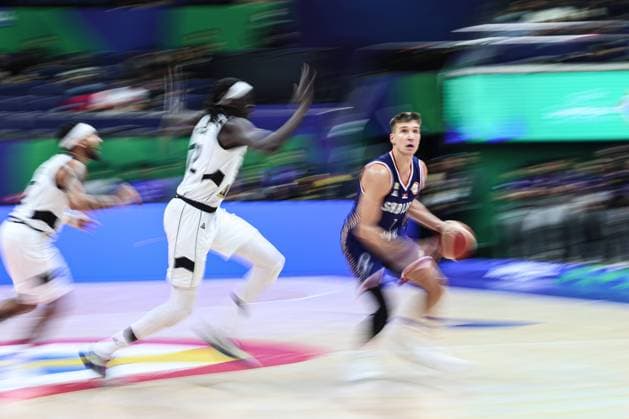 (230830) -- MANILA, Aug. 30, 2023 -- Bogdan Bogdanovic (R) of Serbia drives the ball during the group B match between South Sudan and Serbia at the 2023 FIBA World Cup in Manila, the Philippines, Aug. 30, 2023. ) (SP)PHILIPPINES-MANILA-FIBA BASKETBALL WORLD CUP-GROUP B-SSD VS SRB WuxZhuang 