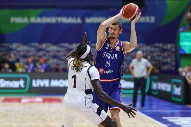 MANILA, PHILIPPINES - AUGUST 30: Borisa Simanic 28 of Serbia drives the ball against Nuni Omot 1 of South Sudan during the first round Group B match between South Sudan and Serbia on day 6 of the FIBA Basketball World Cup at Araneta Coliseum on August 30, 2023 in Manila, Philippines.  Copyright: xVCGx 111451745104