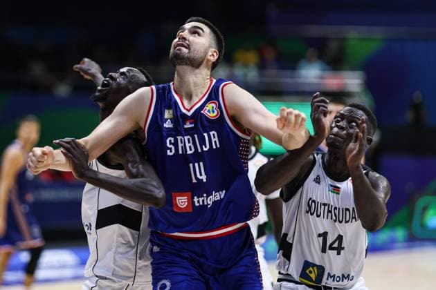 MANILA, PHILIPPINES - AUGUST 30: Dusan Ristic 14 of Serbia competes for a rebound against Dut Jok Kacuol 14 of South Sudan during the first round Group B match between South Sudan and Serbia on day 6 of the FIBA Basketball World Cup at Araneta Coliseum on August 30, 2023 in Manila, Philippines.  Copyright: xVCGx 111451745062