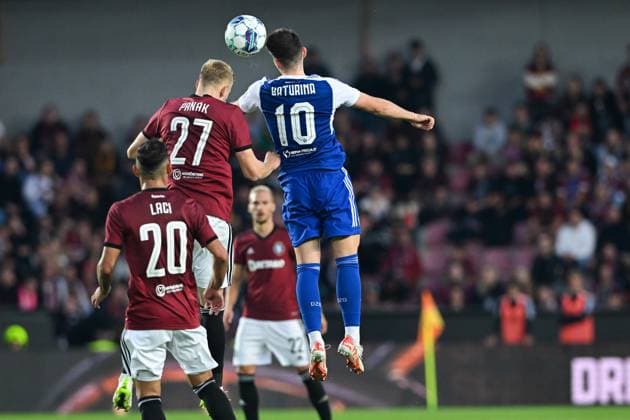 Sparta Praha v Dinamo Zagreb - UEFA Europa League Play Off Round: Second Leg Filip Panak of Sparta Praha and Martin Baturina of Dinamo Zagreb jumping for a ball during the UEFA Europa League Play Off Round Second Leg match between Sparta Praha and Dinamo Zagreb at Letna Stadium on August 31, 2023 in Prague, Czech Republic. MarkoxLukunic PIXSELL