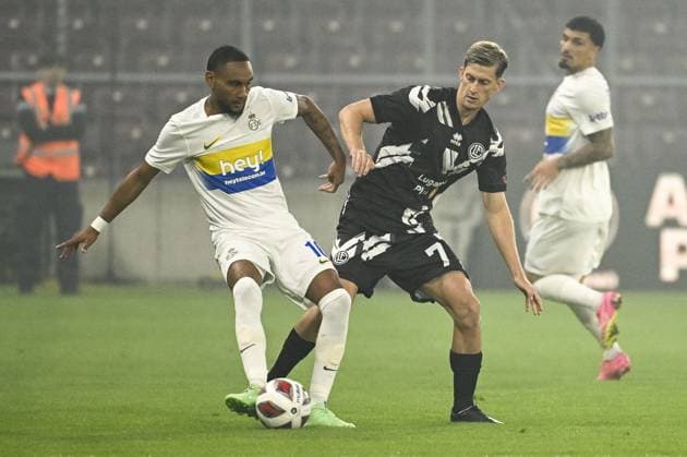Union s Loic Lapoussin and Lugano s Roman Macek pictured in action during a soccer match between Swiss FC Lugano and Belgian Royale Union Saint-Gilloise, Thursday 31 August 2023 in Geneva, Switzerland, the return leg of the play-off for the UEFA Europa League competition. LAURIExDIEFFEMBACQ  x73072192x