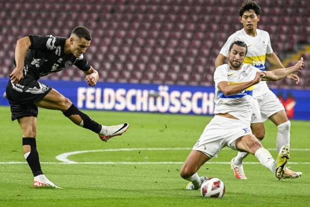 Lugano s Zan Celar and Union s Christian Burgess fight for the ball during a soccer match between Swiss FC Lugano and Belgian Royale Union Saint-Gilloise, Thursday 31 August 2023 in Geneva, Switzerland, the return leg of the play-off for the UEFA Europa League competition. LAURIExDIEFFEMBACQ  x73074939x