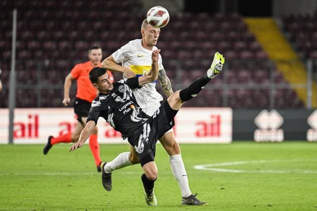 Lugano s Albian Hajdari and Union s Gustaf Nilsson fight for the ball during a soccer match between Swiss FC Lugano and Belgian Royale Union Saint-Gilloise, Thursday 31 August 2023 in Geneva, Switzerland, the return leg of the play-off for the UEFA Europa League competition. LAURIExDIEFFEMBACQ  x73083748x