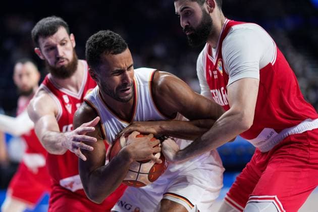 (230901) -- OKINAWA, Sept. 1, 2023 -- Johannes Thiemann (C) of Germany vies with Goga Bitadze (R) of Georgia during the second round match between Germany and Georgia at the 2023 FIBA World Cup in Okinawa, Japan, Sept. 1, 2023. ) (SP)JAPAN-OKINAWA-BASKETBALL-FIBA WORLD CUP-SECOND ROUND-GER VS GEO ZhangxXiaoyu 