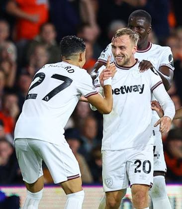Mandatory Credit: Photo by Michael Zemanek Shutterstock (14074701ab) Jarrod Bowen of West Ham United celebrates scoring the opening goal with team-mates Luton Town v West Ham United, Premier League, Football, Kenilworth Road, Luton, UK - 01 Sep 2023 EDITORIAL USE ONLY No use with unauthorised audio, video, data, fixture lists, club league logos or live services. Online in-match use limited to 120 images, no video emulation. No use in betting, games or single club league player publications. Luton Town v West Ham United, Premier League, Football, Kenilworth Road, Luton, UK - 01 Sep 2023 EDITORIAL USE ONLY No use with unauthorised audio, video, data, fixture lists, club league logos or live services. Online in-match use limited to 120 images, no video emulation. No use in betting, games or single club league player publications. Copyright: xMichaelxZemanek Shutterstockx 14074701ab