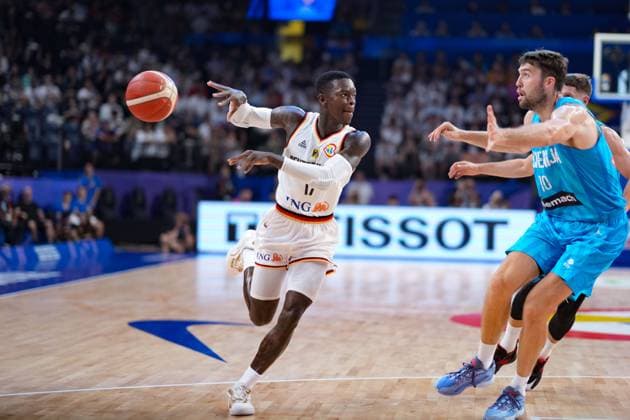 (230903) -- OKINAWA, Sept. 3, 2023 -- Dennis Schroder (L) of Germany passes the ball during the second round match between Germany and Slovenia at the FIBA World Cup 2023 in Okinawa, Japan, Sept. 3, 2023. ) (SP)JAPAN-OKINAWA-BASKETBALL-FIBA WORLD CUP-SECOND ROUND-GER VS SLO ZhangxXiaoyu 