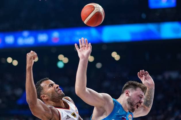(230903) -- OKINAWA, Sept. 3, 2023 -- Johannes Thiemann (L) of Germany vies with Luka Doncic of Slovenia for a rebound during the second round match between Germany and Slovenia at the FIBA World Cup 2023 in Okinawa, Japan, Sept. 3, 2023. ) (SP)JAPAN-OKINAWA-BASKETBALL-FIBA WORLD CUP-SECOND ROUND-GER VS SLO ZhangxXiaoyu 