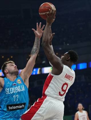 (230906) -- MANILA, Sept. 6, 2023 -- Canada s RJ Barrett (R) shoots during the quarterfinal between Canada and Slovenia at the 2023 FIBA World Cup in Manila, the Philippines, Sept. 6, 2023. ) (SP)PHILIPPINES-MANILA-BASKETBALL-FIBA WORLD CUP-QUARTERFINAL-CAN VS SLO MengxYongmin 
