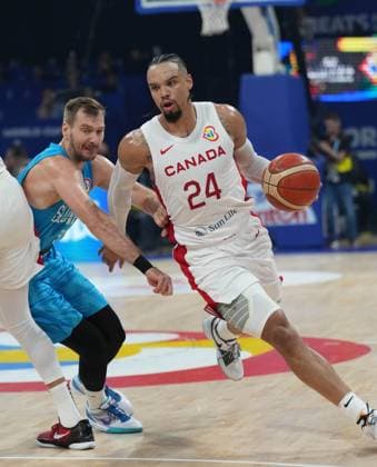 (230906) -- MANILA, Sept. 6, 2023 -- Canada s Dillon Brooks (R) breaks through during the quarterfinal between Canada and Slovenia at the 2023 FIBA World Cup in Manila, the Philippines, Sept. 6, 2023. ) (SP)PHILIPPINES-MANILA-BASKETBALL-FIBA WORLD CUP-QUARTERFINAL-CAN VS SLO MengxYongmin 
