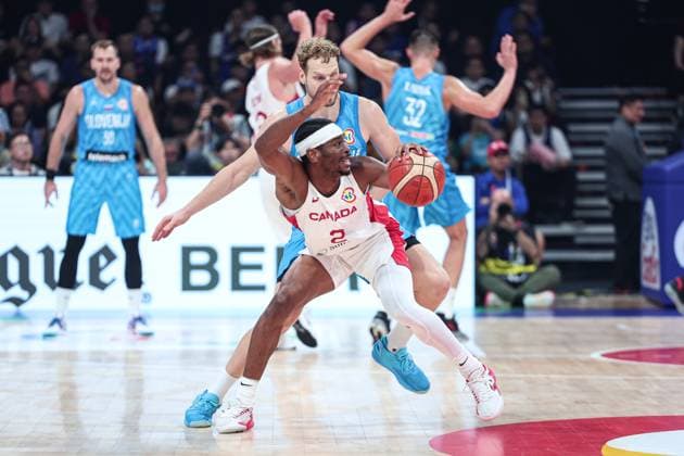 (230906) -- MANILA, Sept. 6, 2023 -- Canada s Shai Gilgeous-Alexander (front) competes during the quarterfinal between Canada and Slovenia at the 2023 FIBA World Cup in Manila, the Philippines, Sept. 6, 2023. ) (SP)PHILIPPINES-MANILA-BASKETBALL-FIBA WORLD CUP-QUARTERFINAL-CAN VS SLO WuxZhuang 