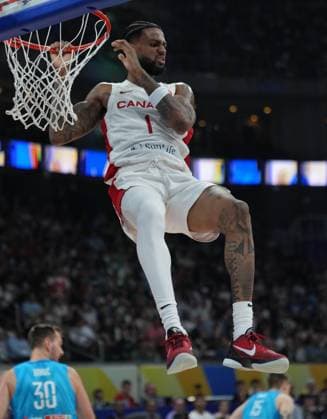 (230906) -- MANILA, Sept. 6, 2023 -- Canada s Nickeil Alexander-Walker celebrates after a dunk during the quarterfinal between Canada and Slovenia at the 2023 FIBA World Cup in Manila, the Philippines, Sept. 6, 2023. ) (SP)PHILIPPINES-MANILA-BASKETBALL-FIBA WORLD CUP-QUARTERFINAL-CAN VS SLO MengxYongmin 