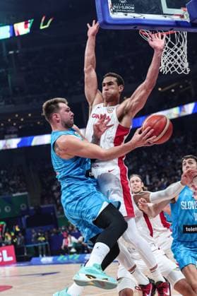 (230906) -- MANILA, Sept. 6, 2023 -- Slovenia s Luka Doncic (L) passes the ball during the quarterfinal between Canada and Slovenia at the 2023 FIBA World Cup in Manila, the Philippines, Sept. 6, 2023. ) (SP)PHILIPPINES-MANILA-BASKETBALL-FIBA WORLD CUP-QUARTERFINAL-CAN VS SLO WuxZhuang 