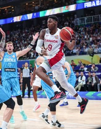 (230906) -- MANILA, Sept. 6, 2023 -- Canada s RJ Barrett (R) prepares to pass the ball during the quarterfinal between Canada and Slovenia at the 2023 FIBA World Cup in Manila, the Philippines, Sept. 6, 2023. ) (SP)PHILIPPINES-MANILA-BASKETBALL-FIBA WORLD CUP-QUARTERFINAL-CAN VS SLO WuxZhuang 