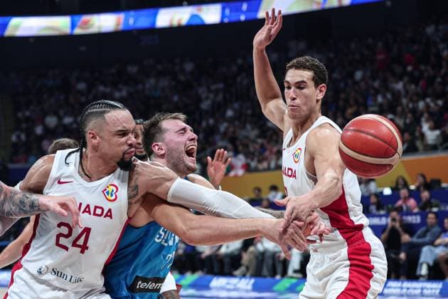 (230906) -- MANILA, Sept. 6, 2023 -- Slovenia s Luka Doncic (C) vies for the ball during the quarterfinal between Canada and Slovenia at the 2023 FIBA World Cup in Manila, the Philippines, Sept. 6, 2023. ) (SP)PHILIPPINES-MANILA-BASKETBALL-FIBA WORLD CUP-QUARTERFINAL-CAN VS SLO WuxZhuang 