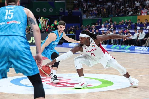(230906) -- MANILA, Sept. 6, 2023 -- Canada s Luguentz Dort (R) vies for the ball during the quarterfinal between Canada and Slovenia at the 2023 FIBA World Cup in Manila, the Philippines, Sept. 6, 2023. ) (SP)PHILIPPINES-MANILA-BASKETBALL-FIBA WORLD CUP-QUARTERFINAL-CAN VS SLO WuxZhuang 
