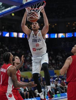 (230908) -- MANILA, Sept. 8, 2023 -- Serbia s Nikola Milutinov (top) dunks during the semifinal between Serbia and Canada at the 2023 FIBA World Cup in Manila, the Philippines, Sept. 8, 2023. ) (SP)PHILIPPINES-MANILA-BASKETBALL-FIBA WORLD CUP-SEMIFINAL-SRB VS CAN MengxYongmin 