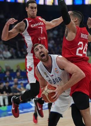 (230908) -- MANILA, Sept. 8, 2023 -- Serbia s Nikola Milutinov (C) competes during the semifinal between Serbia and Canada at the 2023 FIBA World Cup in Manila, the Philippines, Sept. 8, 2023. ) (SP)PHILIPPINES-MANILA-BASKETBALL-FIBA WORLD CUP-SEMIFINAL-SRB VS CAN MengxYongmin 
