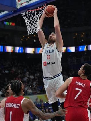 (230908) -- MANILA, Sept. 8, 2023 -- Serbia s Nikola Milutinov (top) dunks during the semifinal between Serbia and Canada at the 2023 FIBA World Cup in Manila, the Philippines, Sept. 8, 2023. ) (SP)PHILIPPINES-MANILA-BASKETBALL-FIBA WORLD CUP-SEMIFINAL-SRB VS CAN MengxYongmin 