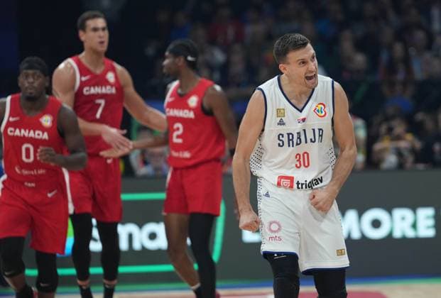 (230908) -- MANILA, Sept. 8, 2023 -- Serbia s Aleksa Avramovic (1st R) celebrates during the semifinal between Serbia and Canada at the 2023 FIBA World Cup in Manila, the Philippines, Sept. 8, 2023. ) (SP)PHILIPPINES-MANILA-BASKETBALL-FIBA WORLD CUP-SEMIFINAL-SRB VS CAN MengxYongmin 