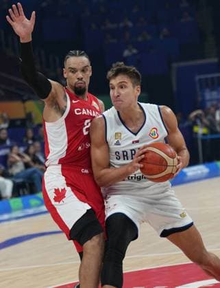 (230908) -- MANILA, Sept. 8, 2023 -- Serbia s Bogdan Bogdanovic (R) breaks through during the semifinal between Serbia and Canada at the 2023 FIBA World Cup in Manila, the Philippines, Sept. 8, 2023. ) (SP)PHILIPPINES-MANILA-BASKETBALL-FIBA WORLD CUP-SEMIFINAL-SRB VS CAN MengxYongmin 