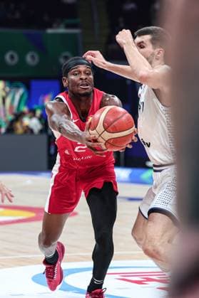 (230908) -- MANILA, Sept. 8, 2023 -- Canada s Shai Gilgeous-Alexander (L) passes the ball during the semifinal between Serbia and Canada at the 2023 FIBA World Cup in Manila, the Philippines, Sept. 8, 2023. ) (SP)PHILIPPINES-MANILA-BASKETBALL-FIBA WORLD CUP-SEMIFINAL-SRB VS CAN WuxZhuang 