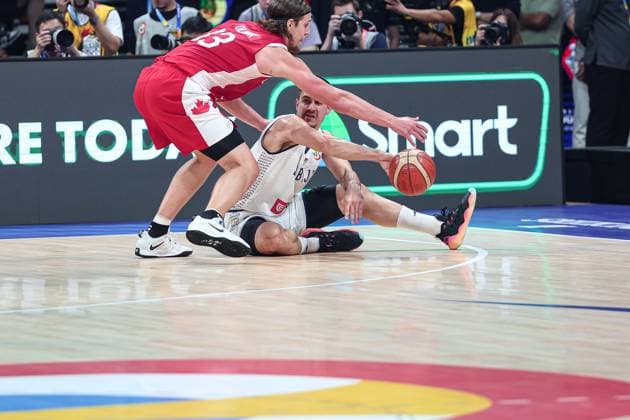 (230908) -- MANILA, Sept. 8, 2023 -- Canada s Kelly Olynyk (L) vies for the ball with Serbia s Ognjen Dobric during the semifinal between Serbia and Canada at the 2023 FIBA World Cup in Manila, the Philippines, Sept. 8, 2023. ) (SP)PHILIPPINES-MANILA-BASKETBALL-FIBA WORLD CUP-SEMIFINAL-SRB VS CAN WuxZhuang 