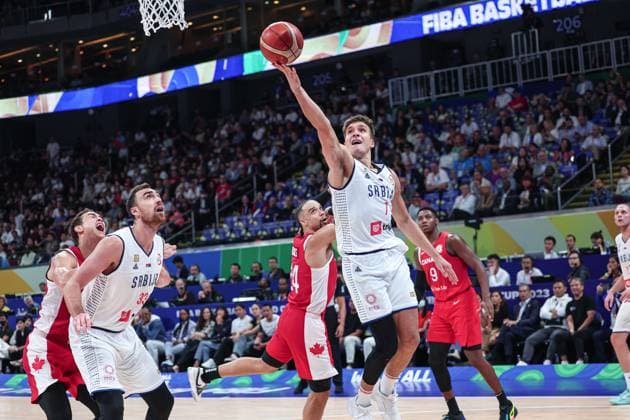 (230908) -- MANILA, Sept. 8, 2023 -- Serbia s Bogdan Bogdanovic (top) goes for a lay-up during the semifinal between Serbia and Canada at the 2023 FIBA World Cup in Manila, the Philippines, Sept. 8, 2023. ) (SP)PHILIPPINES-MANILA-BASKETBALL-FIBA WORLD CUP-SEMIFINAL-SRB VS CAN WuxZhuang 