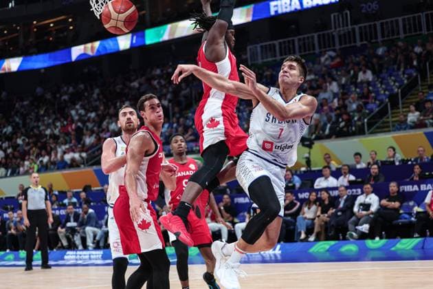 (230908) -- MANILA, Sept. 8, 2023 -- Serbia s Bogdan Bogdanovic (1st R) passes the ball during the semifinal between Serbia and Canada at the 2023 FIBA World Cup in Manila, the Philippines, Sept. 8, 2023. ) (SP)PHILIPPINES-MANILA-BASKETBALL-FIBA WORLD CUP-SEMIFINAL-SRB VS CAN WuxZhuang 