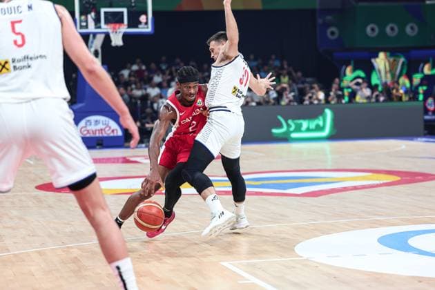 (230908) -- MANILA, Sept. 8, 2023 -- Canada s Shai Gilgeous-Alexander (L) breaks through during the semifinal between Serbia and Canada at the 2023 FIBA World Cup in Manila, the Philippines, Sept. 8, 2023. ) (SP)PHILIPPINES-MANILA-BASKETBALL-FIBA WORLD CUP-SEMIFINAL-SRB VS CAN WuxZhuang 