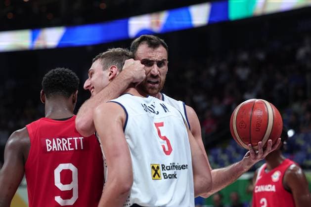 (230908) -- MANILA, Sept. 8, 2023 -- Serbia s Nikola Milutinov (R) hugs Nikola Jovic after winning the semifinal between Serbia and Canada at the 2023 FIBA World Cup in Manila, the Philippines, Sept. 8, 2023. ) (SP)PHILIPPINES-MANILA-BASKETBALL-FIBA WORLD CUP-SEMIFINAL-SRB VS CAN WuxZhuang 