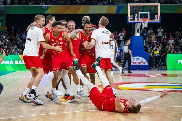 Basketball Manila Pasay 08 09 2023 FIBA Basketball World Cup 2023 Mens World Cup Semifinals United States of America USA Germany GER Germany wins and is in the final Andreas Obst Germany, No 42 on the floor Nils Giffey Germany, No 05 Maodo Lo Germany, No 04 Daniel Theis Germany, No 10 Johannes Thiemann Germany, No 32 Justus Hollatz Germany, No 21 and others cheering