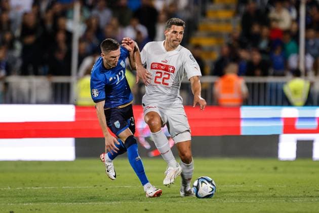 PRISTINA, KOSOVO SEPTEMBER 9 Fabian Schar of Switzerland R against Altin Zeqiri of Kosovo L during the UEFA EURO 2024 European qualifier match between Kosovo and Switzerland at Fadil Vokrri Stadium on September 9, 2023 in Pristina, Kosovo Pristina Fadil Vokrri Stadium Kosovo Copyright: xJustPictures.ch NikolaxKrsticx jp-en-EuSpIm-20230909 _S2A3250