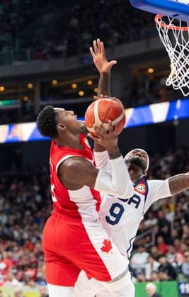 September 10, 2023, Manila, Philippines: FIBA World Cup Basketball 3rd 4th playoff U.S.A. vs Canada at the Mall of Asia Arena Manila Philippines. Canadas RJ BARRETT is stopped from scoring by USAs Bobby PORTIS Jr. Manila Philippines - ZUMAr144 20230910_zap_r144_009 Copyright: xJaynexRussellx